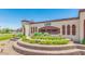 Elegant community entrance sign with decorative landscaping and manicured garden beds at 1255 N Arizona Ave # 1297, Chandler, AZ 85225