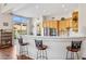 Modern kitchen with breakfast bar, white quartz countertops and stainless steel appliances at 14204 N Bursage Dr, Fountain Hills, AZ 85268