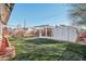 Landscaped backyard with a pergola and shed at 1521 W Garfield St, Phoenix, AZ 85007