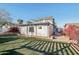 Backyard view of the property with a patio and landscaping at 1521 W Garfield St, Phoenix, AZ 85007