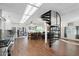 Open concept kitchen and living area with a spiral staircase at 1521 W Garfield St, Phoenix, AZ 85007