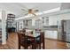 Modern kitchen with white cabinets, granite countertops, and a breakfast bar at 1521 W Garfield St, Phoenix, AZ 85007