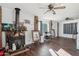 Living room with wood floors, brick fireplace, and large windows at 1521 W Garfield St, Phoenix, AZ 85007