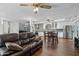 Living room with brown leather couch and spiral staircase at 1521 W Garfield St, Phoenix, AZ 85007