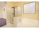 Bathroom with shower and tub, plus a block window at 1523 E Constance Way, Phoenix, AZ 85042