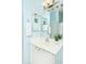 Light blue bathroom with white vanity and mirror at 1523 E Constance Way, Phoenix, AZ 85042