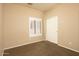 Bedroom with carpet, window shutters, and closet at 1523 E Constance Way, Phoenix, AZ 85042