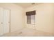 Simple bedroom with carpet and window coverings at 1523 E Constance Way, Phoenix, AZ 85042