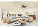 Living room with beige sectional sofa and wooden coffee table at 1523 E Constance Way, Phoenix, AZ 85042