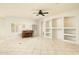 Living room with built-in shelving and a piano at 1523 E Constance Way, Phoenix, AZ 85042