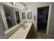 Bathroom with double vanity and walk-in closet at 1534 E Alba Dr, Casa Grande, AZ 85122