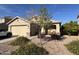 House exterior with two-car garage and desert landscaping at 1534 E Alba Dr, Casa Grande, AZ 85122