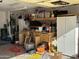 Garage with workbench, storage cabinets, and various tools at 1534 E Alba Dr, Casa Grande, AZ 85122