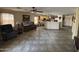 Open living room with tile flooring and a view of the kitchen at 1534 E Alba Dr, Casa Grande, AZ 85122