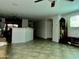 Living room with tile floor and large screen TV at 1534 E Alba Dr, Casa Grande, AZ 85122