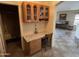 Built-in office space with wood cabinets and granite countertop at 1534 E Alba Dr, Casa Grande, AZ 85122