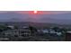 Aerial view of homes with sunset mountain views at 16548 E Emerald Dr, Fountain Hills, AZ 85268