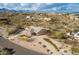 Aerial view of a house with a large backyard and a three-car garage at 16548 E Emerald Dr, Fountain Hills, AZ 85268