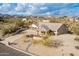 Aerial view of single story home with desert landscaping and driveway at 16548 E Emerald Dr, Fountain Hills, AZ 85268