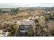 Aerial view of house with backyard patio and surrounding desert landscape at 16548 E Emerald Dr, Fountain Hills, AZ 85268