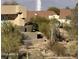 Landscaped backyard with desert plants and retaining walls at 16548 E Emerald Dr, Fountain Hills, AZ 85268