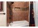 Bathroom with shower/tub combo and decorative tile at 16548 E Emerald Dr, Fountain Hills, AZ 85268