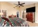 Bright bedroom with king-size bed and ensuite bathroom access at 16548 E Emerald Dr, Fountain Hills, AZ 85268