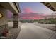 Driveway leading to home with mountain views at sunset at 16548 E Emerald Dr, Fountain Hills, AZ 85268