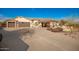 House with a three-car garage and a covered patio at 16548 E Emerald Dr, Fountain Hills, AZ 85268