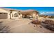 Home with a covered entryway and a three car garage at 16548 E Emerald Dr, Fountain Hills, AZ 85268