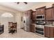 Kitchen features stainless steel appliances and breakfast nook at 16548 E Emerald Dr, Fountain Hills, AZ 85268