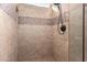 Walk-in shower with stone tile detail and modern fixtures at 16548 E Emerald Dr, Fountain Hills, AZ 85268