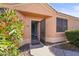 Inviting front entry with a pink door and security screen at 17216 E Salida Dr # B, Fountain Hills, AZ 85268