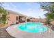 Inviting kidney-shaped pool with surrounding patio and lush landscaping at 17216 E Salida Dr # B, Fountain Hills, AZ 85268