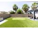 Artificial turf backyard with putting green and pergola at 18147 W Lundberg St, Surprise, AZ 85388