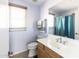 Small bathroom with shower, toilet and vanity at 18147 W Lundberg St, Surprise, AZ 85388