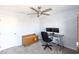 Spacious bedroom with a desk and ceiling fan at 18147 W Lundberg St, Surprise, AZ 85388