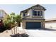 Two-story house with stone accents and a two-car garage at 18147 W Lundberg St, Surprise, AZ 85388