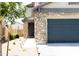 Two-story house with stone accents and a two-car garage at 18147 W Lundberg St, Surprise, AZ 85388