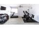 Bright home gym featuring Peloton bikes and a treadmill at 18147 W Lundberg St, Surprise, AZ 85388