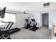 Home gym with two stationary bikes and a treadmill at 18147 W Lundberg St, Surprise, AZ 85388