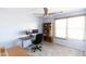 Bright home office features built-in shelving and a desk at 18147 W Lundberg St, Surprise, AZ 85388