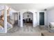 Living room featuring a home office and dark door at 18147 W Lundberg St, Surprise, AZ 85388