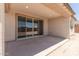 Covered back patio with large sliding glass doors, perfect for outdoor entertaining at 18225 W Hess St, Goodyear, AZ 85338