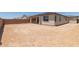 A nice backyard with a covered patio showing a blank slate for gardening or play at 18225 W Hess St, Goodyear, AZ 85338