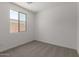 This airy bedroom features neutral carpet and a bright window at 18225 W Hess St, Goodyear, AZ 85338