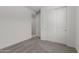 A modern bedroom features carpeted floors and access to an adjoining room at 18225 W Hess St, Goodyear, AZ 85338