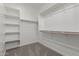 Walk-in closet features carpeted floors, shelving, and ample storage space at 18225 W Hess St, Goodyear, AZ 85338