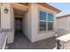 Welcoming entryway featuring a stylish front door and decorative stone accents at 18225 W Hess St, Goodyear, AZ 85338