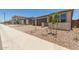 Charming home with desert landscaping, paver driveway, and a three-car garage at 18225 W Hess St, Goodyear, AZ 85338